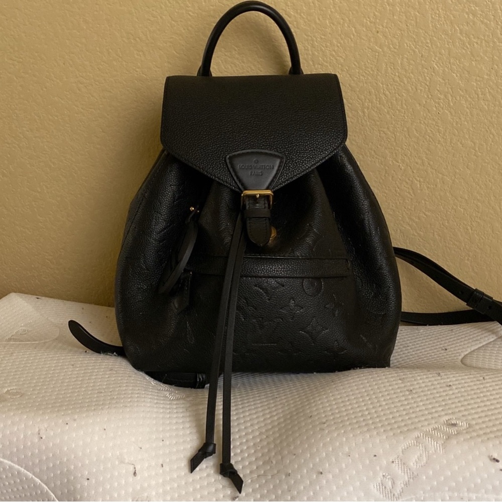 Louis Vuitton Black Backpack with Sleek Design and Gold Accents